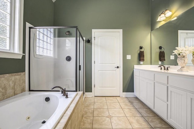 212 Westwind Dr, Newnan, GA 30263 - bathroom with a shower stall, vanity, a tub with jets, and tile patterned floors