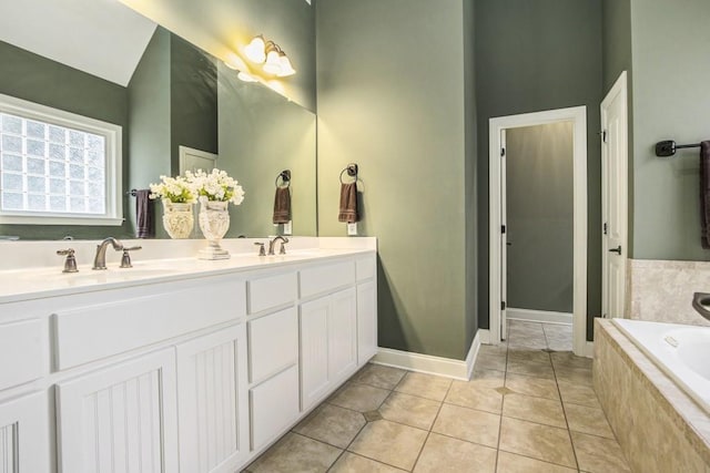 212 Westwind Dr, Newnan, GA 30263 - bathroom with double vanity, a bath, and tile patterned floors