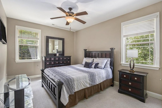 212 Westwind Dr, Newnan, GA 30263 - bedroom featuring light colored carpet and a ceiling fan