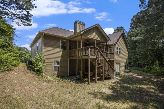212 Westwind Dr, Newnan, GA 30263 - rear view of house with a ceiling fan, stairway, a chimney, a wooden deck, and a shingled roof