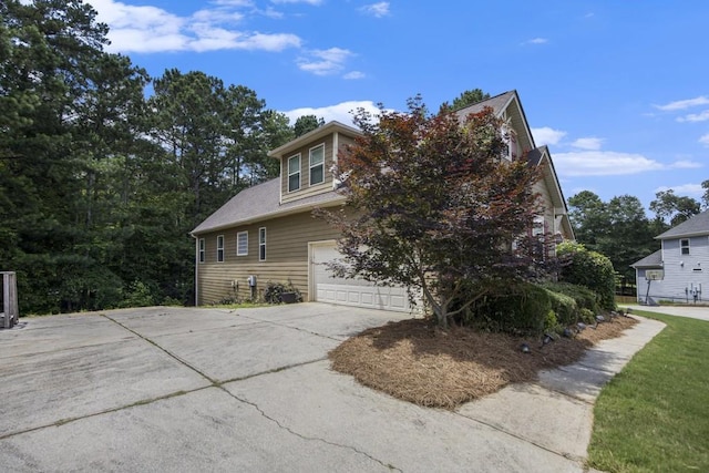 212 Westwind Dr, Newnan, GA 30263 - view of side of property with an attached garage and concrete driveway