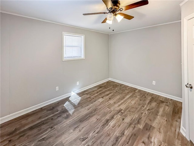 spare room with ornamental molding, wood-type flooring, and ceiling fan