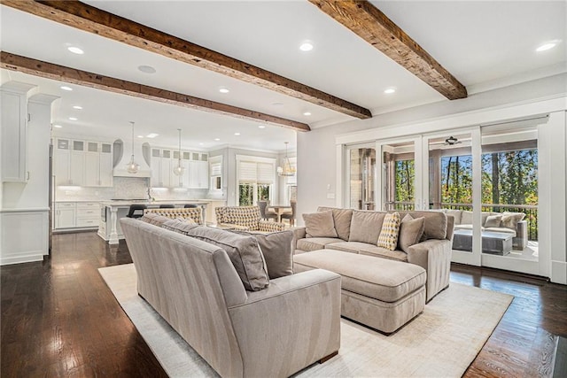 living room featuring plenty of natural light, wood finished floors, and french doors