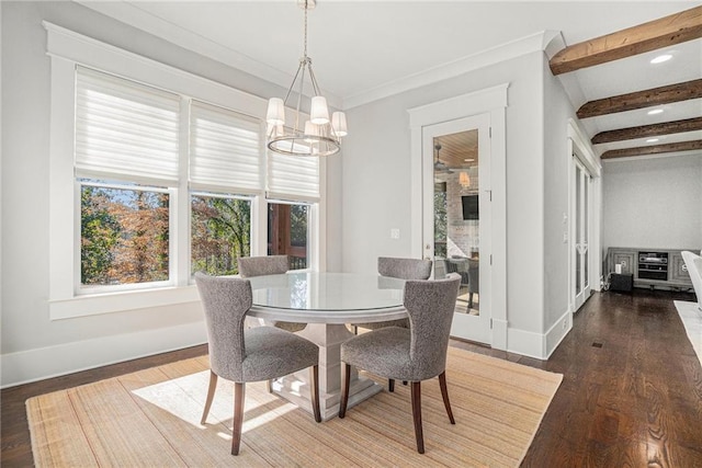 dining space with wood finished floors, baseboards, ornamental molding, beamed ceiling, and an inviting chandelier