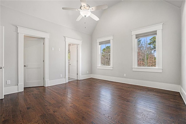 unfurnished bedroom featuring ceiling fan, baseboards, vaulted ceiling, and wood finished floors