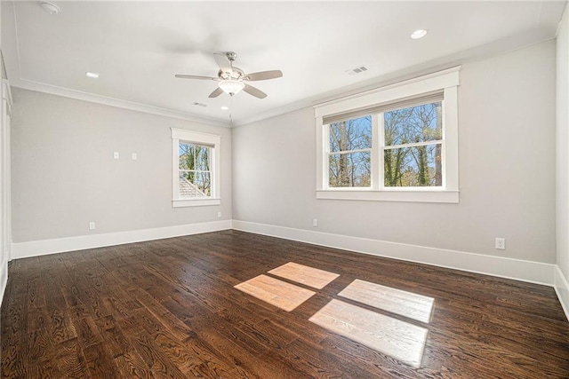 unfurnished room with baseboards, dark wood finished floors, a ceiling fan, crown molding, and recessed lighting