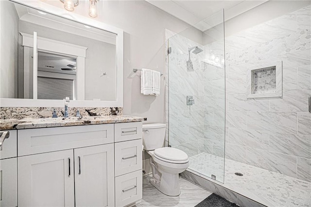 full bathroom with toilet, marble finish floor, and a shower stall