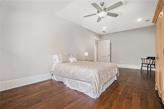 bedroom with recessed lighting, dark wood finished floors, visible vents, and baseboards