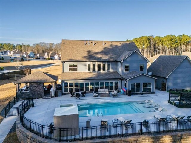 149 Avalon Way, Sharpsburg, GA 30277 - rear view of house featuring a patio, outdoor lounge area, a gazebo, and a residential view