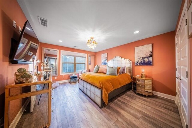149 Avalon Way, Sharpsburg, GA 30277 - bedroom with a chandelier, baseboards, wood finished floors, and recessed lighting