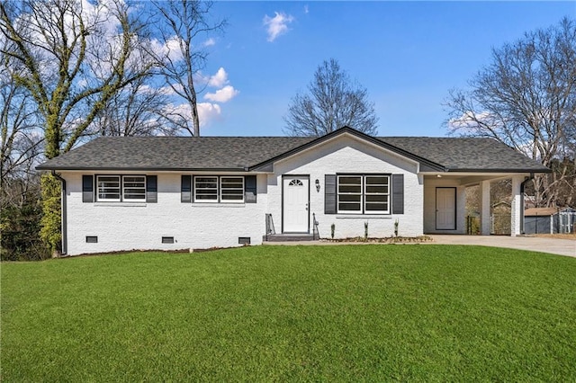 view of front of house with a front lawn and a carport