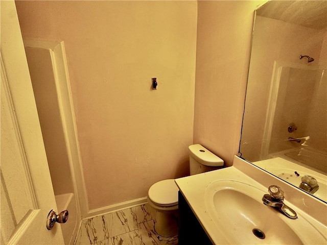 bathroom with shower / bathtub combination, toilet, marble finish floor, baseboards, and vanity