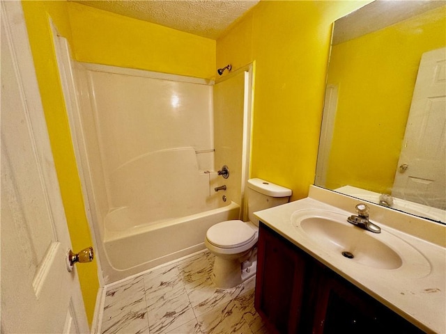 bathroom featuring toilet, tub / shower combination, a textured ceiling, marble finish floor, and vanity