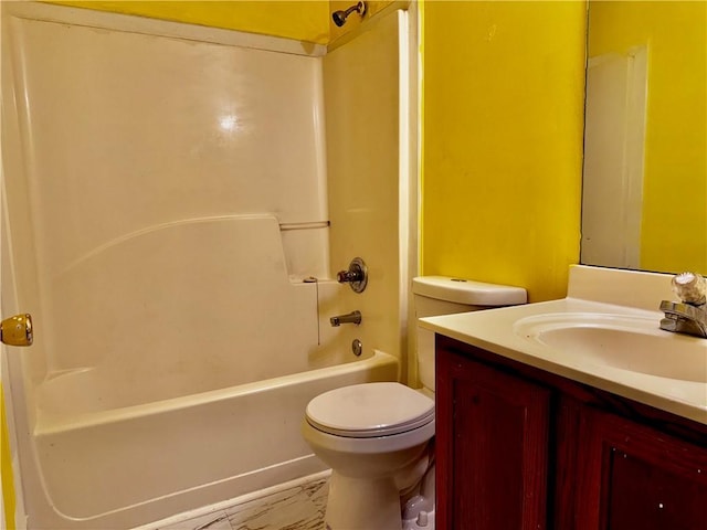 full bathroom featuring vanity, toilet, bathtub / shower combination, and marble finish floor