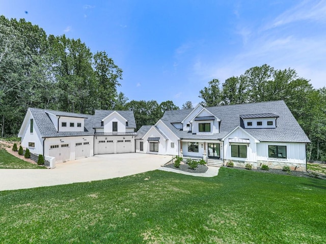 106 Belmont Dr, Canton, GA 30115 - modern farmhouse style home featuring concrete driveway, board and batten siding, a front lawn, a garage, and a shingled roof