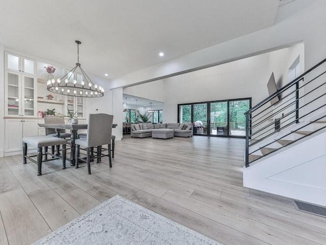 106 Belmont Dr, Canton, GA 30115 - dining room featuring a chandelier, light wood-style floors, stairway, and recessed lighting