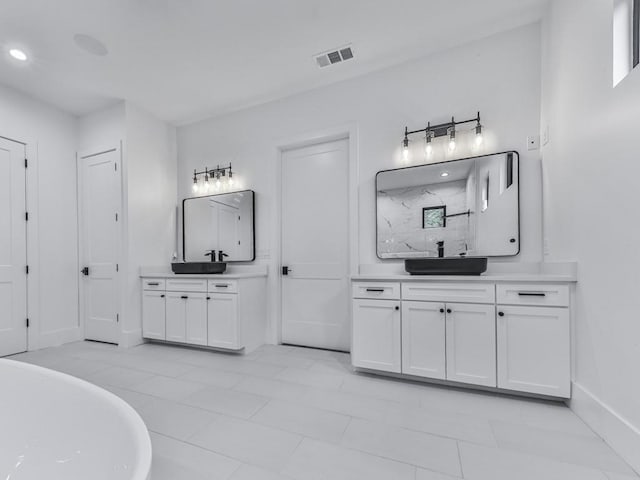 106 Belmont Dr, Canton, GA 30115 - full bath with two vanities, a freestanding bath, a marble finish shower, recessed lighting, and tile patterned floors