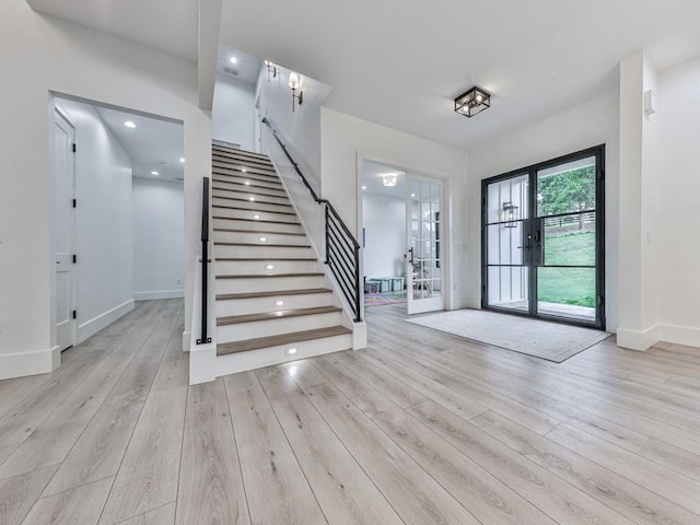 106 Belmont Dr, Canton, GA 30115 - foyer entrance featuring stairs, wood finished floors, and french doors