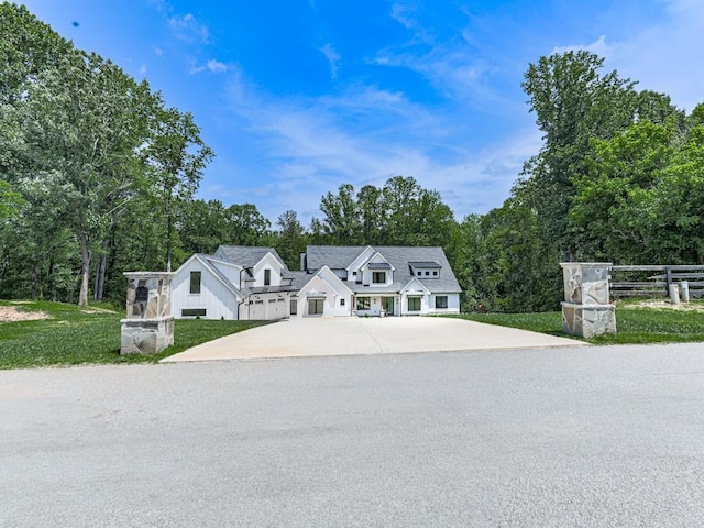 106 Belmont Dr, Canton, GA 30115 - view of front of home with driveway and view of wooded area
