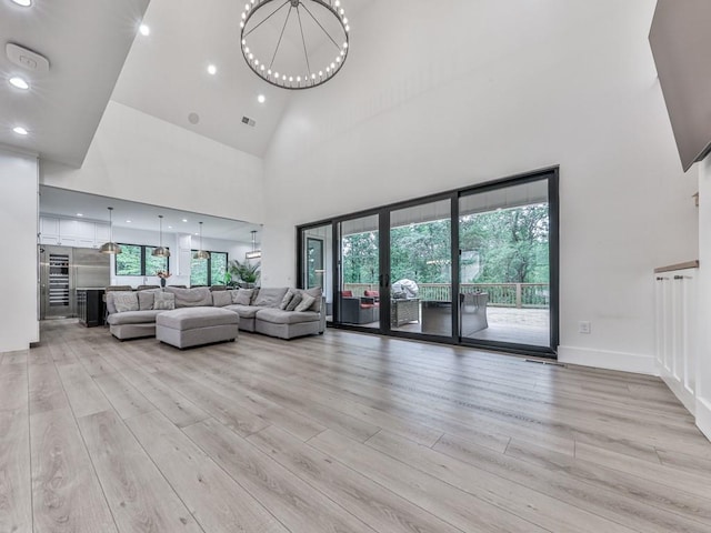 106 Belmont Dr, Canton, GA 30115 - living area featuring a high ceiling, light wood-style flooring, recessed lighting, and a chandelier