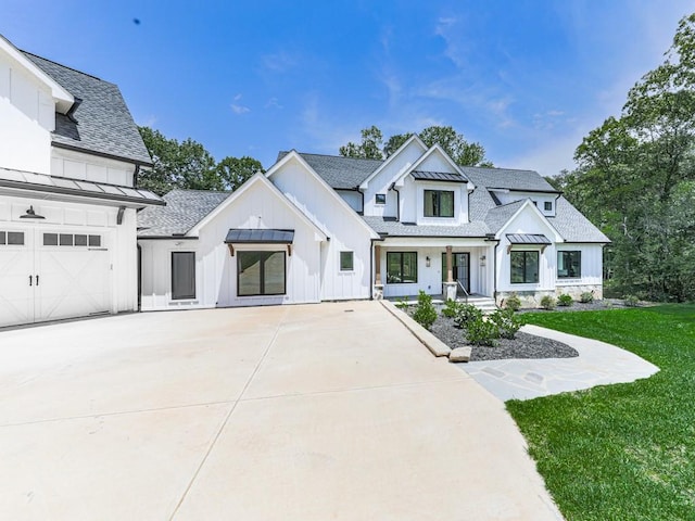106 Belmont Dr, Canton, GA 30115 - modern inspired farmhouse featuring board and batten siding, concrete driveway, a front yard, and roof with shingles