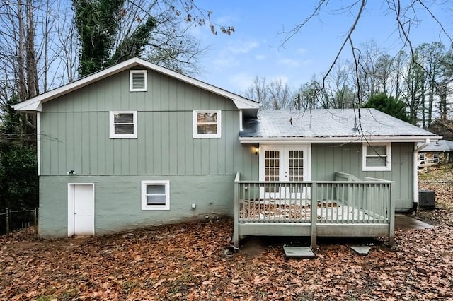 rear view of house featuring french doors and a deck