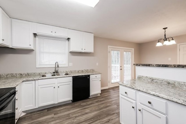 kitchen featuring white cabinetry, sink, hanging light fixtures, and black appliances