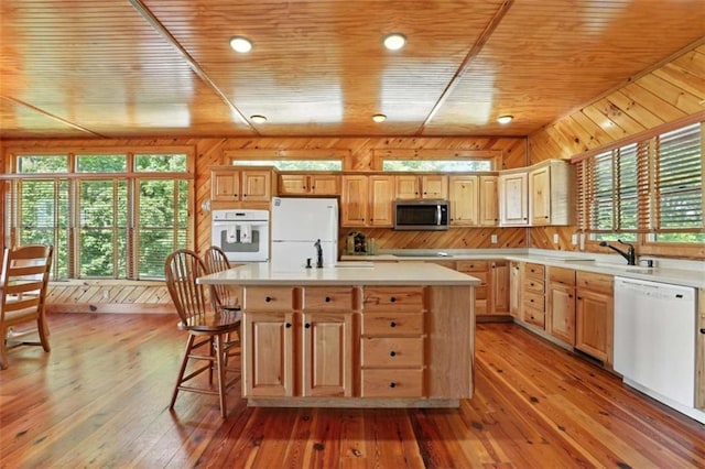 929 Hickory Nut Mountain Rd, Tallulah Falls, GA 30573 - kitchen featuring white appliances, wood ceiling, wooden walls, light countertops, and light wood-style floors
