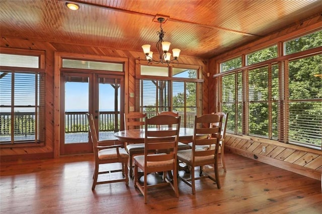 929 Hickory Nut Mountain Rd, Tallulah Falls, GA 30573 - dining area featuring wood walls, a chandelier, wood ceiling, french doors, and hardwood / wood-style floors