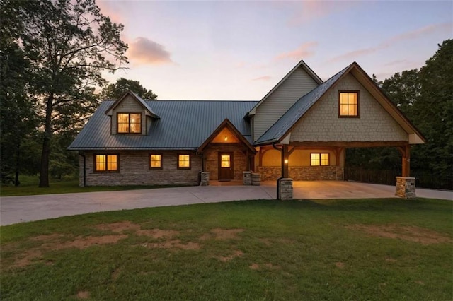 929 Hickory Nut Mountain Rd, Tallulah Falls, GA 30573 - view of front of house with stone siding, a front yard, and curved driveway