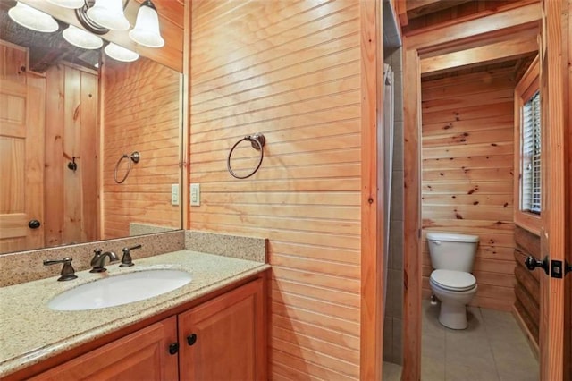 929 Hickory Nut Mountain Rd, Tallulah Falls, GA 30573 - bathroom with wooden walls, vanity, and tile patterned floors