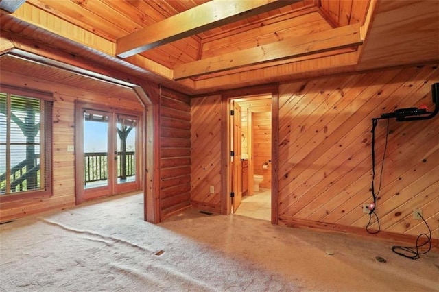 929 Hickory Nut Mountain Rd, Tallulah Falls, GA 30573 - unfurnished room featuring carpet flooring, wood walls, and a wooden ceiling with exposed beams