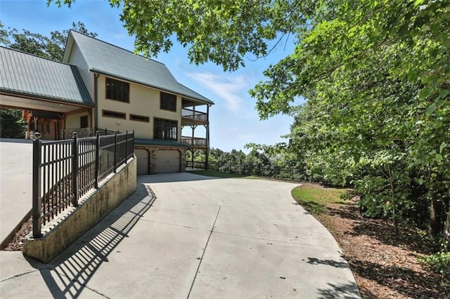 929 Hickory Nut Mountain Rd, Tallulah Falls, GA 30573 - patio / terrace with concrete driveway and an attached garage