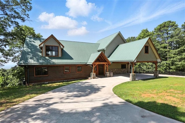 929 Hickory Nut Mountain Rd, Tallulah Falls, GA 30573 - view of front of home with a front lawn, concrete driveway, a carport, a metal roof, and stone siding