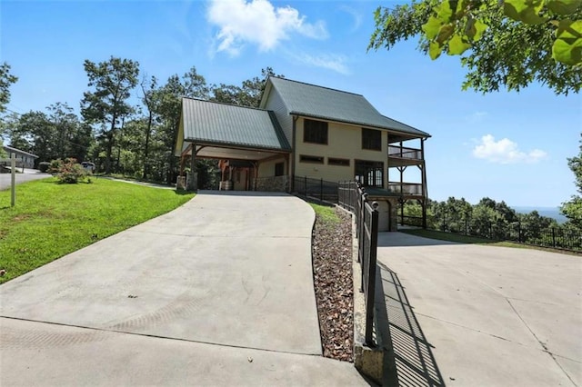 929 Hickory Nut Mountain Rd, Tallulah Falls, GA 30573 - view of front of home with concrete driveway, stone siding, a metal roof, and a garage