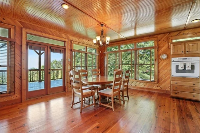 929 Hickory Nut Mountain Rd, Tallulah Falls, GA 30573 - dining area with french doors, wooden ceiling, wooden walls, a chandelier, and light wood finished floors