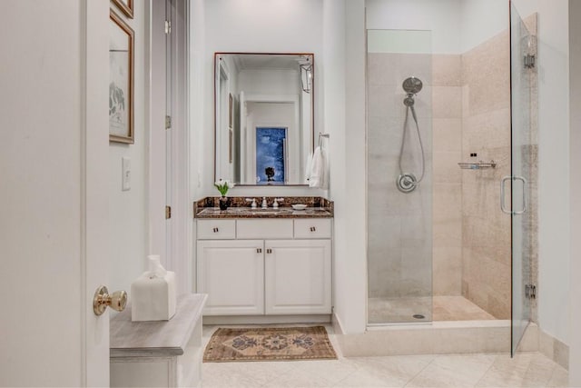 full bath with vanity and a shower stall
