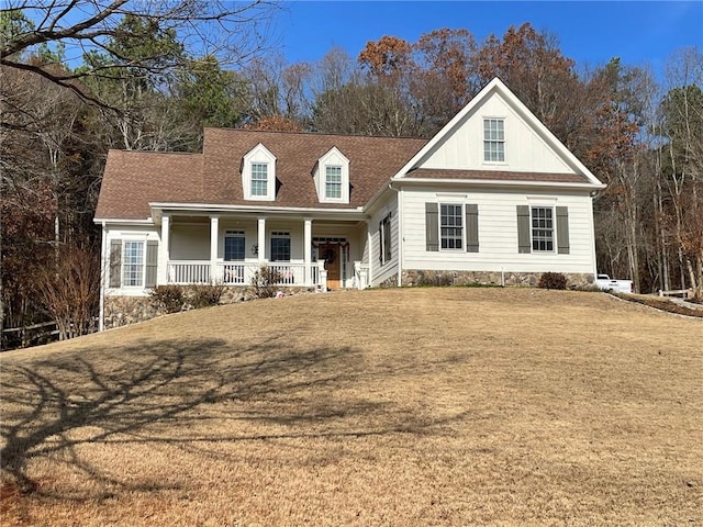 view of front facade with a porch and a front yard