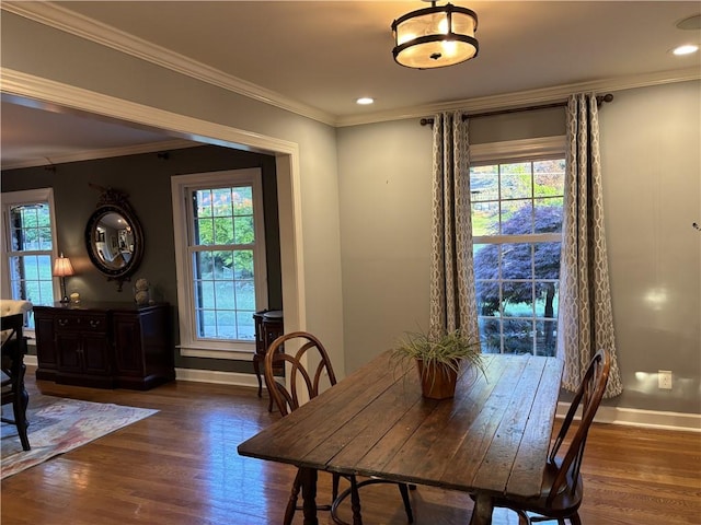 dining area with baseboards, wood finished floors, plenty of natural light, crown molding, and recessed lighting