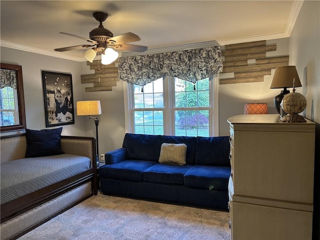 living area with crown molding, healthy amount of natural light, and ceiling fan