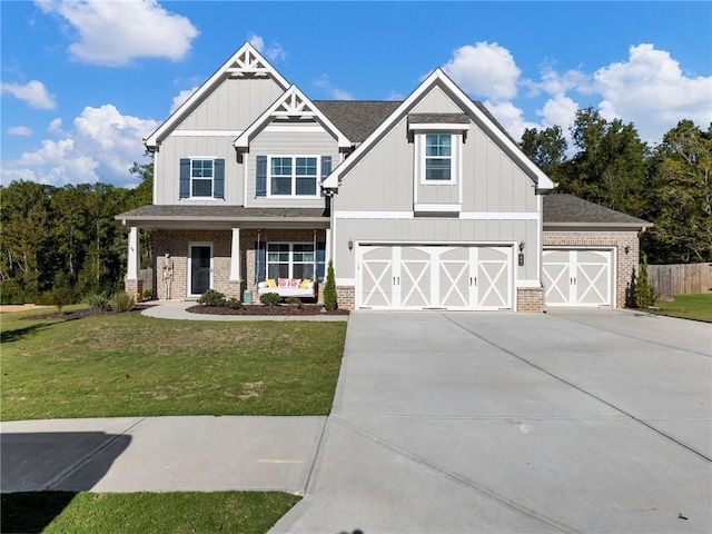 craftsman house with a garage, a front lawn, and a porch