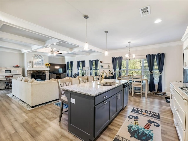 kitchen featuring light hardwood / wood-style floors, sink, and white cabinets