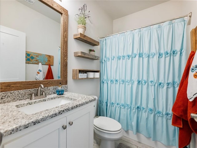 full bathroom featuring vanity, shower / bath combo, and toilet