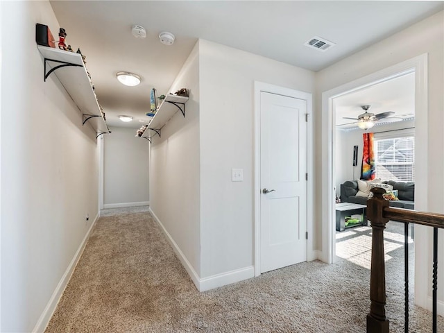 spacious closet with ceiling fan and carpet floors