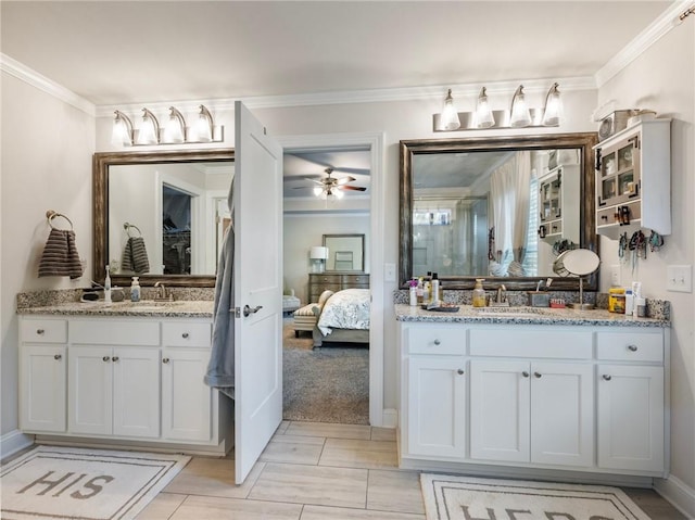 bathroom with vanity, ceiling fan, and ornamental molding