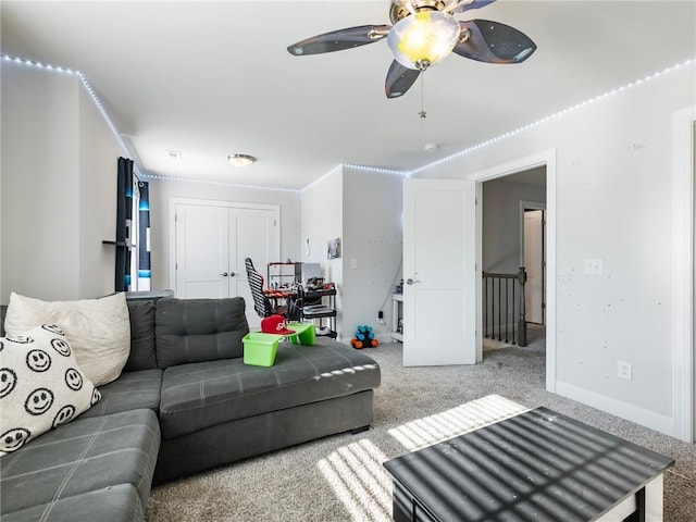 living room with carpet floors and ceiling fan