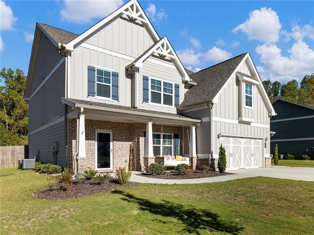 craftsman-style house with a front yard, a garage, central AC unit, and a porch