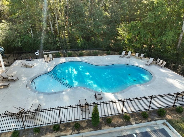 view of swimming pool with a patio