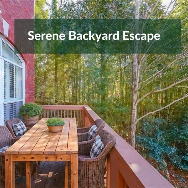 view of wooden balcony with outdoor dining area and a wooden deck