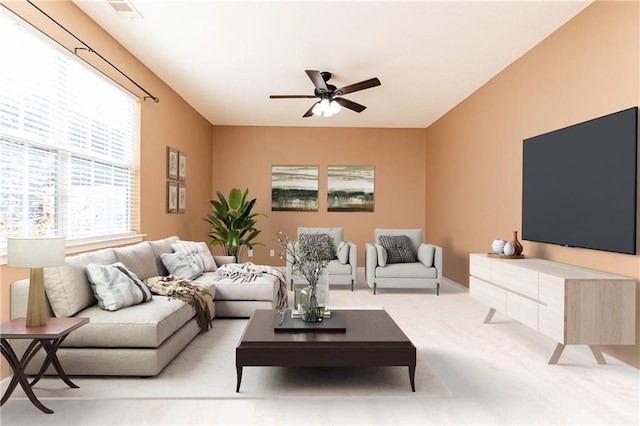 living room featuring ceiling fan and light carpet